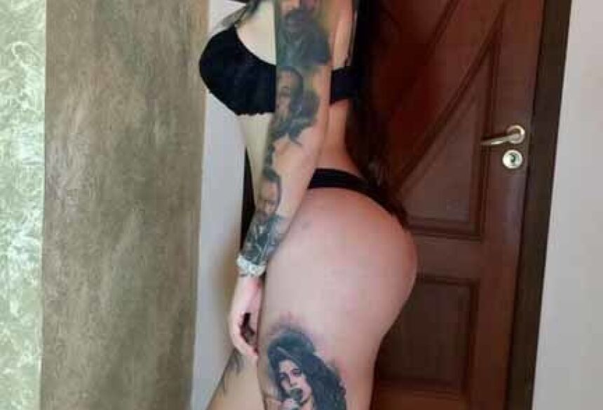 Morena chama atenção pela beleza, altura e suas 42 duas tatuagens